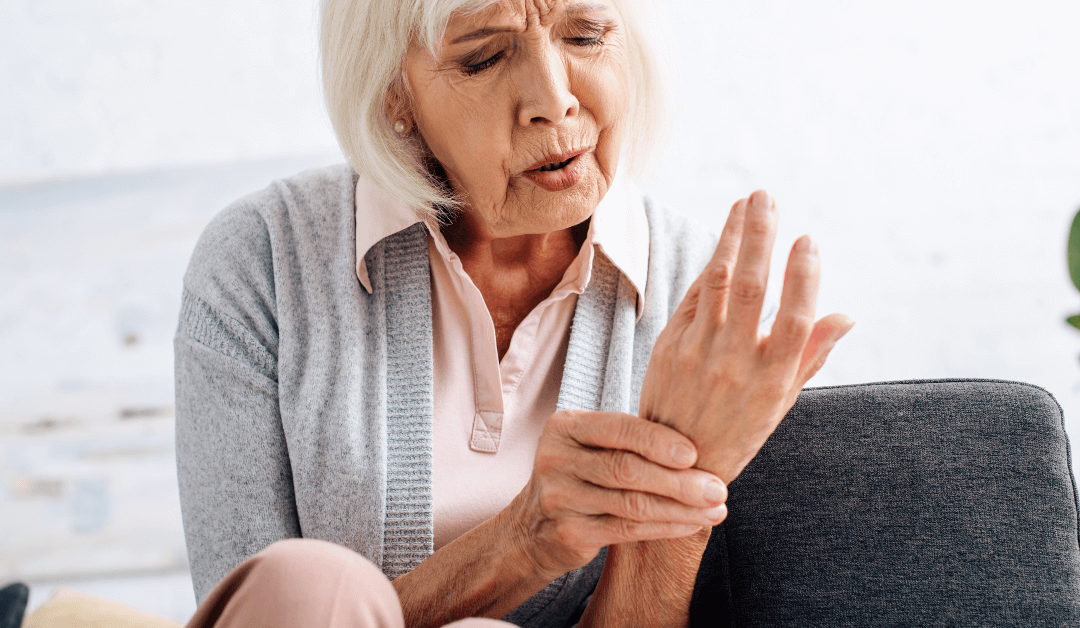 attractive-senior-woman-having-arthritis-in-hand-i