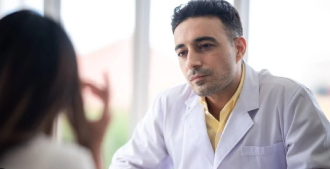 Doctor consulting patient for IV stem cell therapy