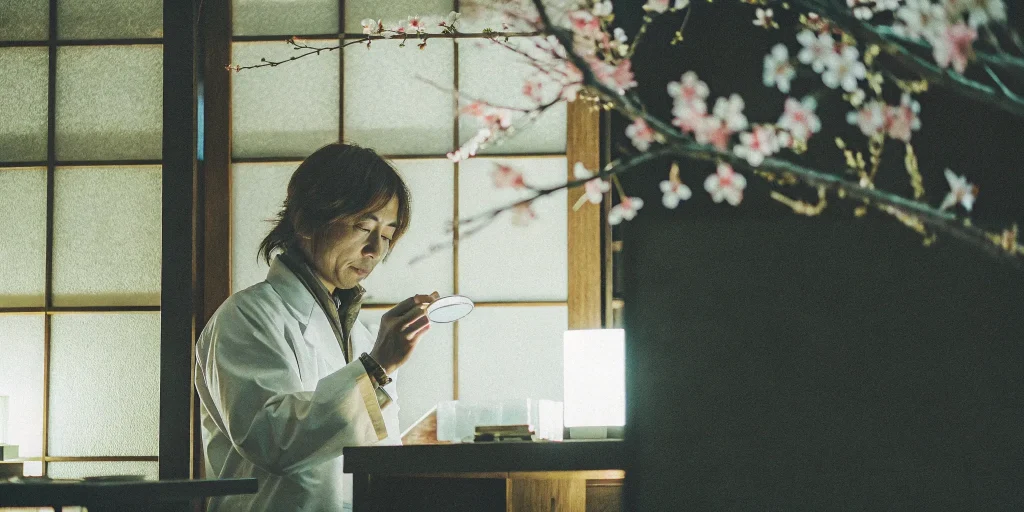 MUSE cell therapy research in a Japanese lab with a scientist examining a sample.